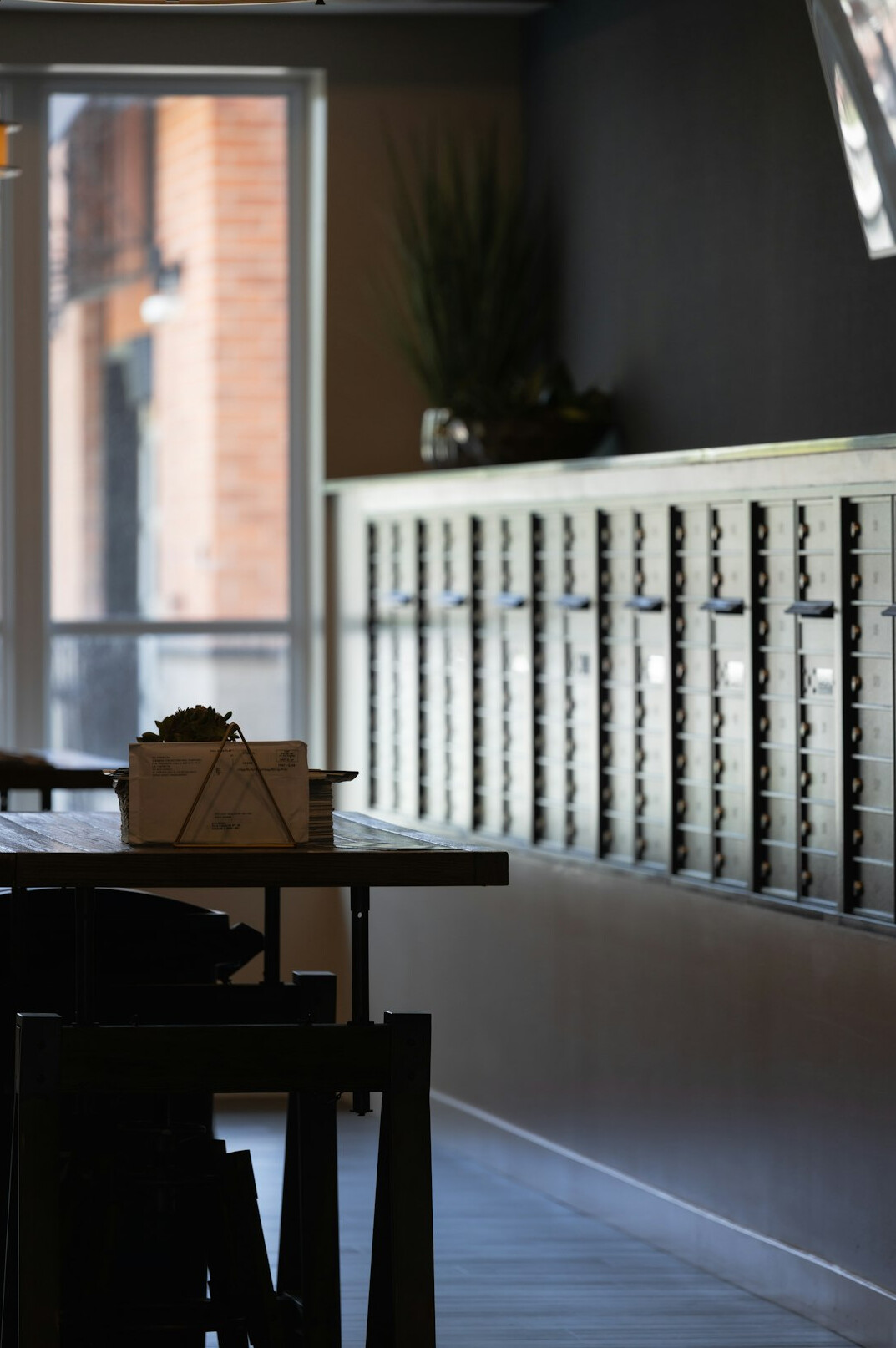 Open mailbox and letters on a wooden table