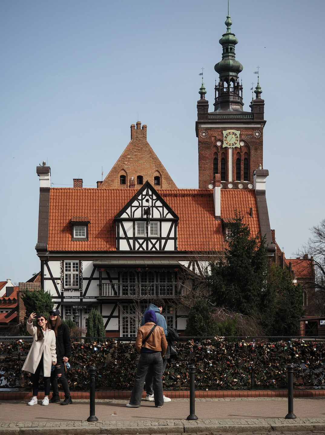Photographer walking through a small Polish town with a camera