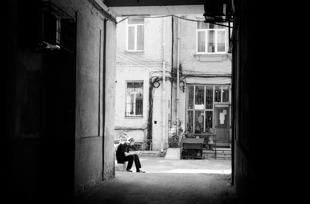 Children playing in a courtyard of a Polish apartment block